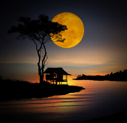 little hut by the ocean under the moon