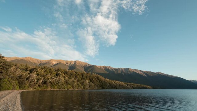 Time-lapse at sunset at Lake Rotoiti looking along the beach to Saint Arnaud ridge. Nelson Lakes National Park, Tasman, New Zealand.