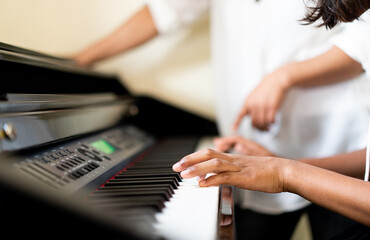 Pre teens girl 12 years old play piano sing a song and worship in sunday service live streaming...