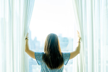 Covid19 lockdown at home.Doctor woman wake up in bedroom at home ready to hospital.Woman girl...