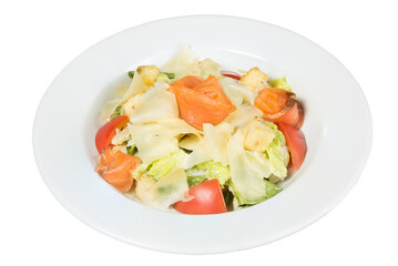 Seafood Caesar salad with shrimp, arugula, and parmesan cheese on a round white plate.