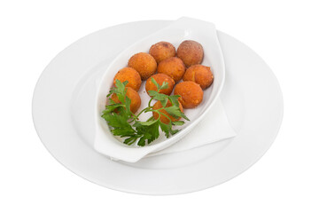 Restaurant service concept. Freshly made minced chicken donuts. Dessert balls on a white plate on the background of the restaurant. Isolated.