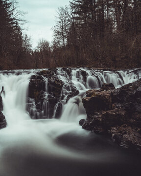 Grayscale photo of waterfalls