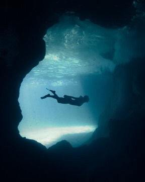 Person diving on body of water