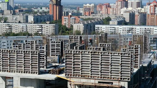 Concrete formwork and crane on construction site