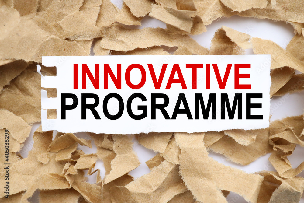 Poster innovative program. text on white paper on torn paper background