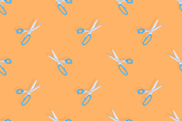 Fototapeta premium Scissors seamless pattern. Barber scissors against orange background backdrop.