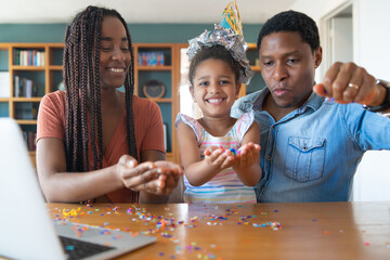 Fototapeta premium Family celebrating birthday online at home.
