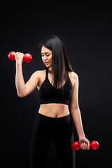 fitness woman is working out with dumbbell, fit female lifting dumbbell, pumping muscles