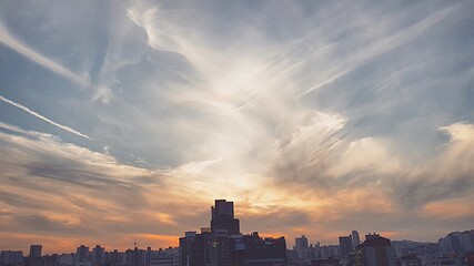 Obraz na płótnie Canvas Buildings In City Against Sky During Sunset