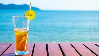 lemon tea glass placed by the sea	