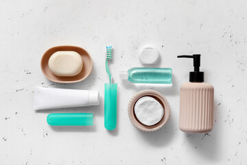 Set of oral hygiene and bath accessories on light background