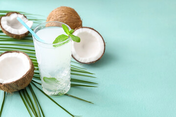 Glass of fresh coconut water on table