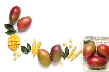 Composition with sweet ripe mangoes on white background
