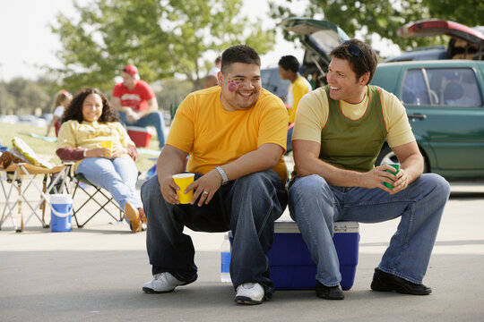 Portrait of two men at tailgate party