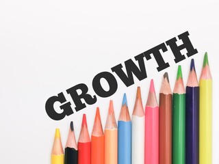 Text GROWTH written on white background with colorful pencil.Education and business concept.