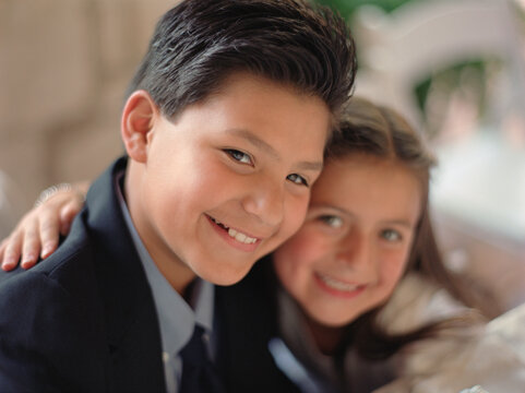 Portrait of girl and boy smiling