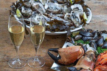 Seafood shellfish plate-Pink prawns, crab claws, Spanish mussels and oysters from Marennes Ol ron