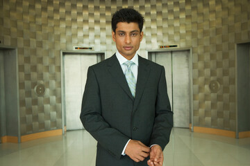Indian businessman in office lobby