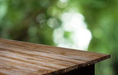 Empty wooden table in front of abstract blurred background of coffee shop . can be used for display or montage your products.Mock up for display of product