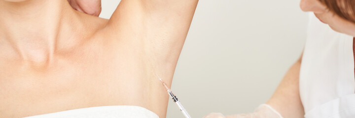 Underarm injection at spa salon. Doctor hands. Female patient. Beauty treatment. Healthy skin...