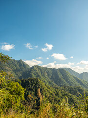 Fototapeta na wymiar mountain landscape, scenery of high green mountains, blue sky with clouds, beauty world.