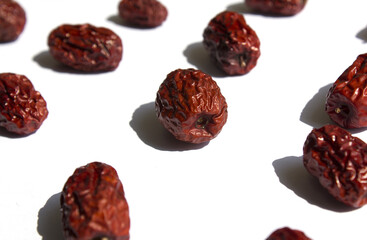 close up Red dates on white background.
