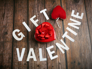 valentine gift box on green background, closeup