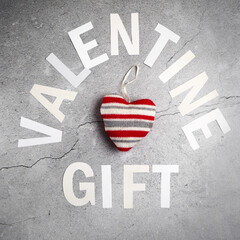 valentine gift box on green background, closeup