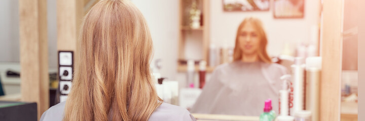 Long hair woman. Hairdresser treatment. Repair procedure. Sit at salon. Bride hairstyle. Curly...