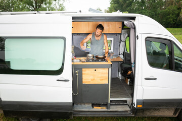Man living in a DIY camper van