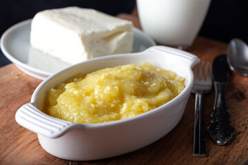 Turkish Cheese Helva Hosmerim with clotted cream and glass of milk.