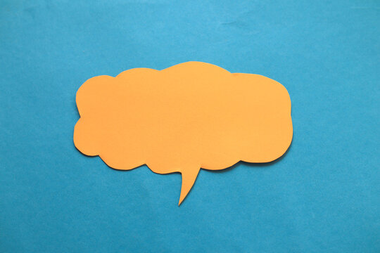 Empty blank color paper speech bubble balloon dialog for your design, flat lay top view