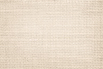 Jute hessian sackcloth canvas woven texture pattern background in light beige cream brown color...