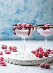 Red Valentine's day cocktail in a glass. Beverage with raspberry
