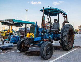 an old tractor on the side of the road in Thailand