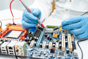 E-waste, technician repairing inside of hard disk by soldering iron. Integrated Circuit. the concept of data, hardware, technician and technology.