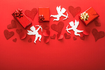 Flying cupid silhouette with hearts, gifts, happy Valentine's Day banners, paper art style. Amour on red paper