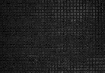 Black tile wall high resolution real photo or brick seamless  pattern and texture interior room background. Dark grid tiles wall texture for the decoration of the bedroom, Home or office backdrop.