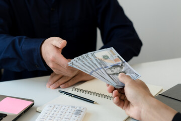 office worker receiving salary from boss.