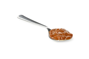 Spoon with caramel condensed milk isolated on white background