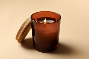 Scented candle for relax on beige background