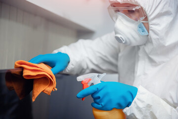 Medical staff cleaning and disinfection with antiseptics of viruses and germs, cleaner service against coronavirus