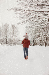 child walking in winter park