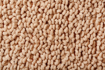 Full screen brown wool loop texture as background.