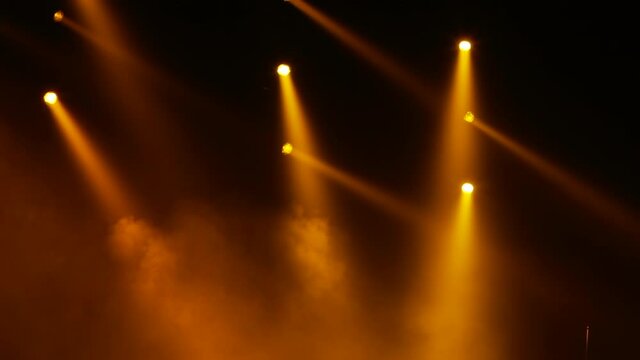 Lighting equipment, Lighting effects. Dynamic strobe light Stage Ray Of Light In Concert Hall. Professional show effects. lights from above soft optical lens flares shiny. rays shiny dynamic