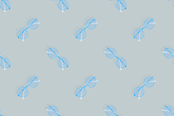 Glasses seamless pattern. Glasses for improving vision on a gray background.