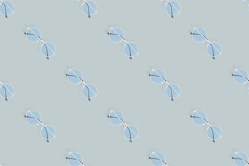 Glasses seamless pattern. Glasses for improving vision on a gray background.