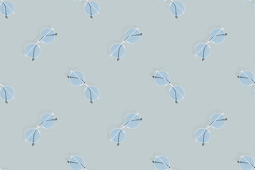 Glasses seamless pattern. Glasses for improving vision on a gray background.