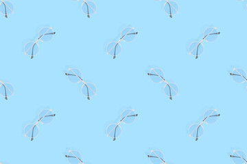 Glasses seamless pattern. Glasses for improving vision on a blue background.